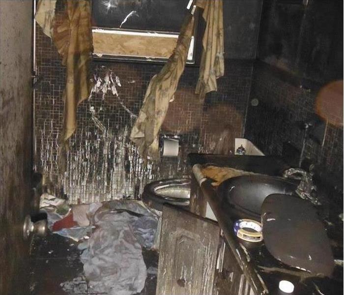 charred, soot, bathroom, a mess